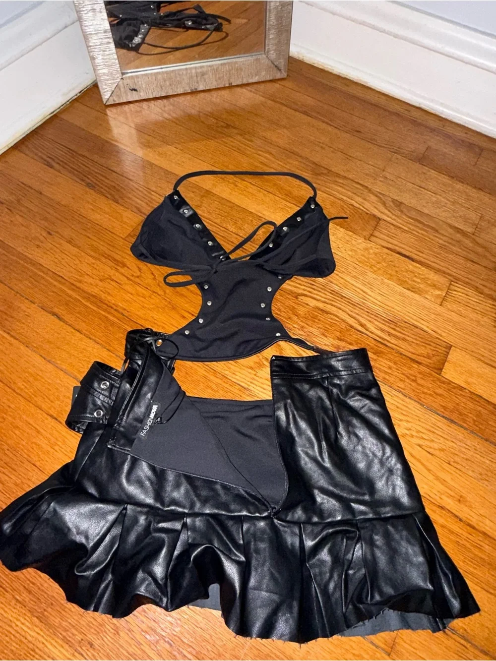 Fashion Nova Black Faux Leather Pleated Mini Skirt one piece with Grommet Detail